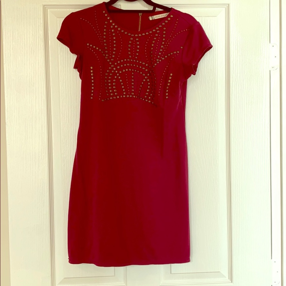 Burgundy dress with brass accents